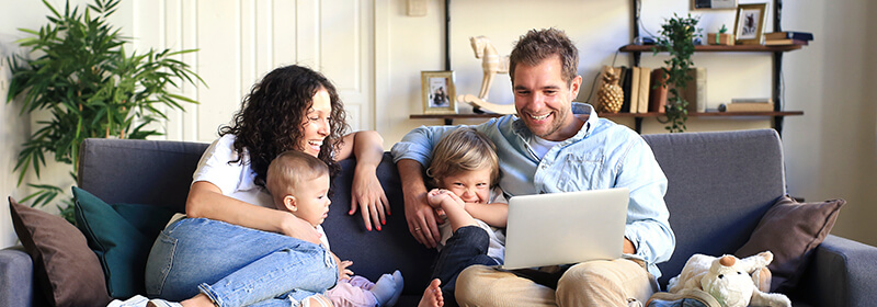 Family around a laptop